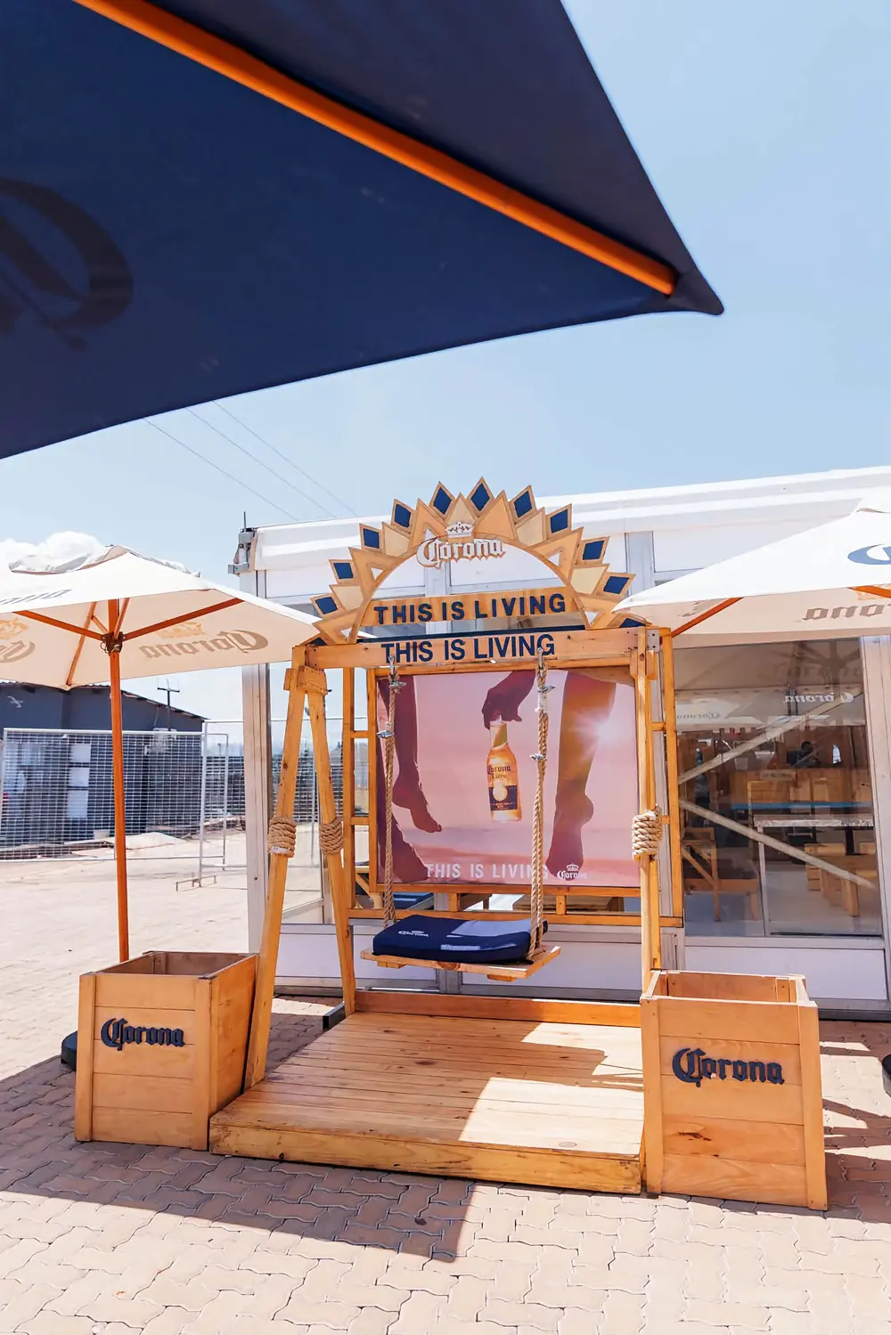 Wooden Corona 'This is Living' swing photo spot